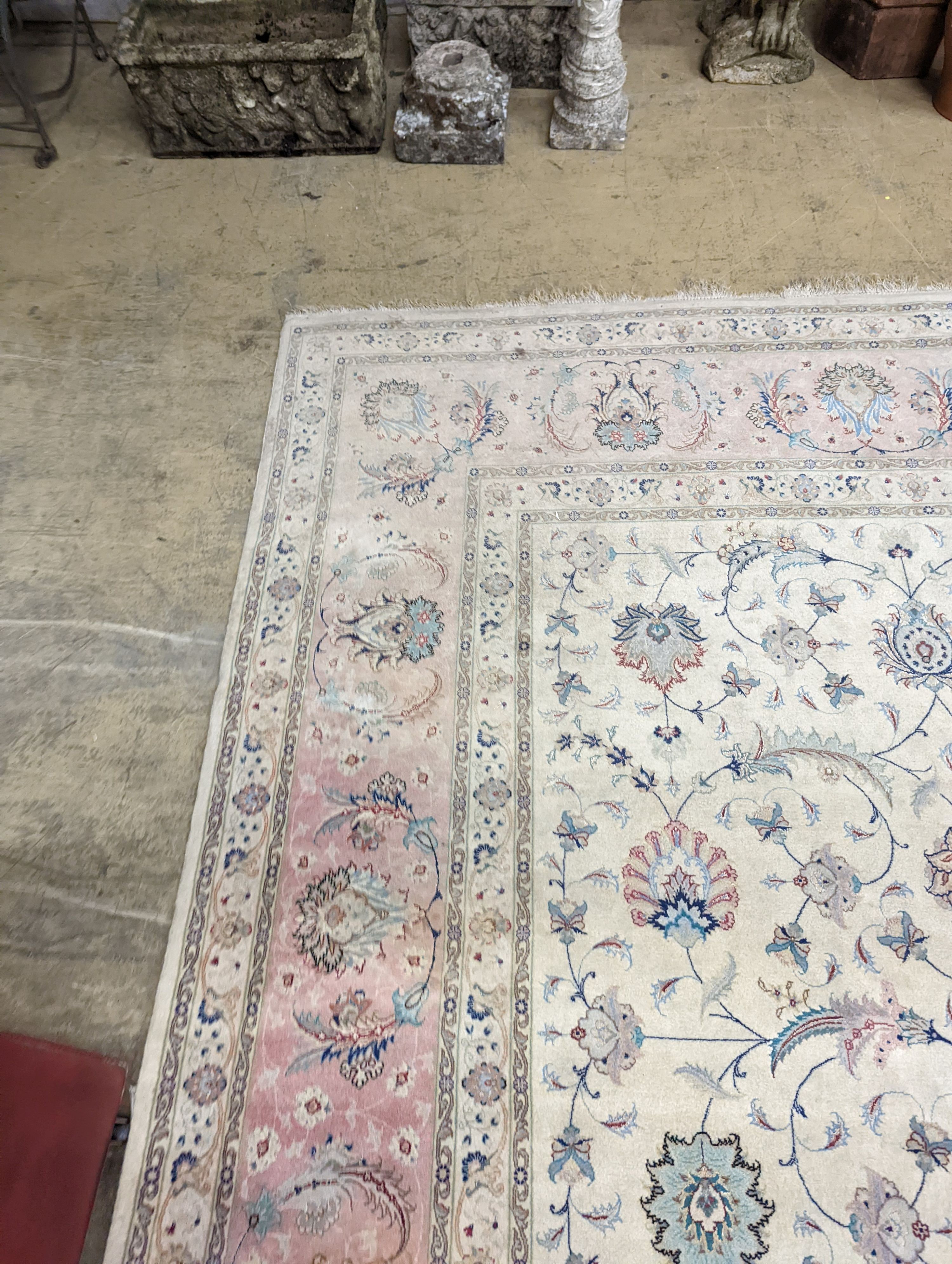 A Persian Tabriz ivory ground carpet, 410 x 300